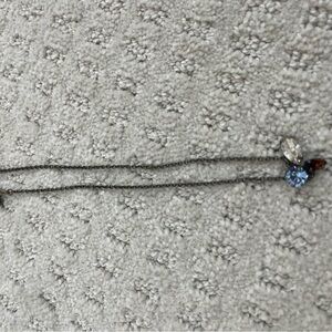 Elegant Silver Necklace with Blue and Clear Pendants